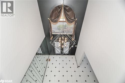 Detailed view of a chandelier and baseboards - 100 National Drive, Hamilton, ON - Indoor Photo Showing Other Room