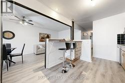 Kitchen Bar overlooks living/dining rooms - 