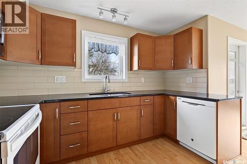 104 2311 Windsor Park Road, Regina, SK - Indoor Photo Showing Kitchen With Double Sink