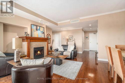 704 - 136 Darlington Private, Ottawa, ON - Indoor Photo Showing Living Room With Fireplace