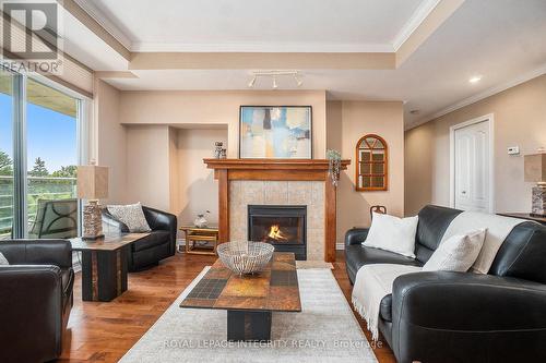 704 - 136 Darlington Private, Ottawa, ON - Indoor Photo Showing Living Room With Fireplace