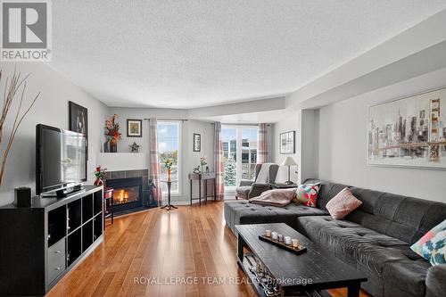 144 Berrigan Drive, Ottawa, ON - Indoor Photo Showing Living Room With Fireplace