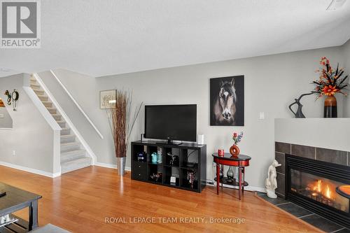 144 Berrigan Drive, Ottawa, ON - Indoor Photo Showing Living Room With Fireplace