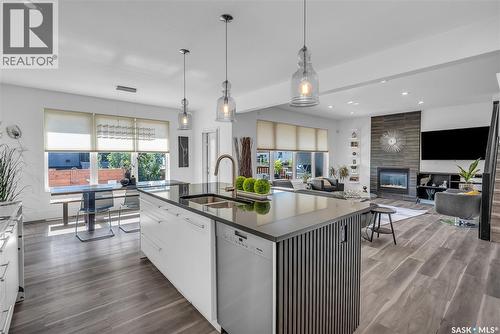 231 Atton Court, Saskatoon, SK - Indoor Photo Showing Kitchen With Fireplace With Double Sink With Upgraded Kitchen
