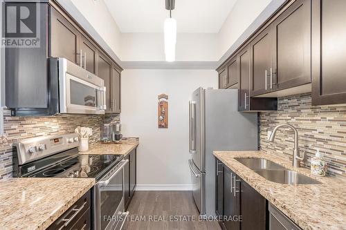 210 - 40 Ferndale Drive S, Barrie, ON - Indoor Photo Showing Kitchen With Double Sink With Upgraded Kitchen