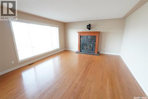15 Christopher Place, White City, SK - Indoor Photo Showing Living Room With Fireplace