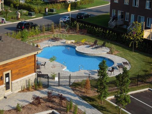 Vue d'ensemble - 104-9 Av. De Sardaigne, Candiac, QC - Outdoor With In Ground Pool