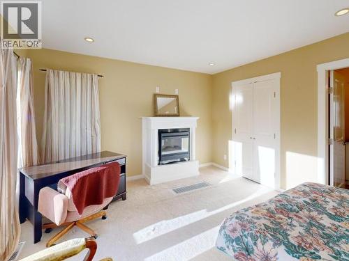 3004 Pebble Beach Road, Powell River, BC - Indoor Photo Showing Bedroom With Fireplace