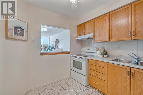 404 - 1270 Maple Crossing Boulevard, Burlington, ON - Indoor Photo Showing Kitchen With Double Sink