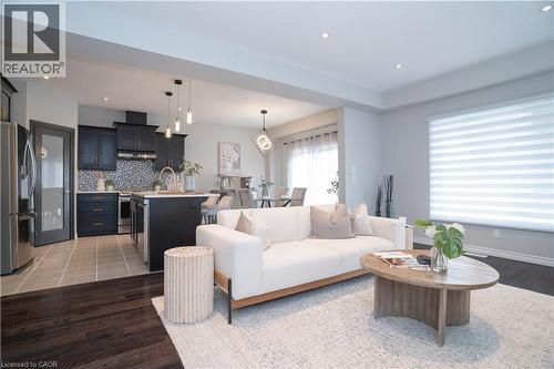 Living area featuring recessed lighting and wood finished floors - 709 Rock Elm Street, Waterloo, ON - Indoor Photo Showing Living Room