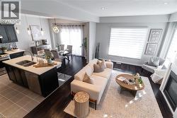 Living room with a textured ceiling and recessed lighting - 