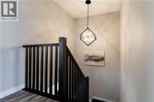 Stairway with wood finished floors and baseboards - 709 Rock Elm Street, Waterloo, ON - Indoor Photo Showing Other Room