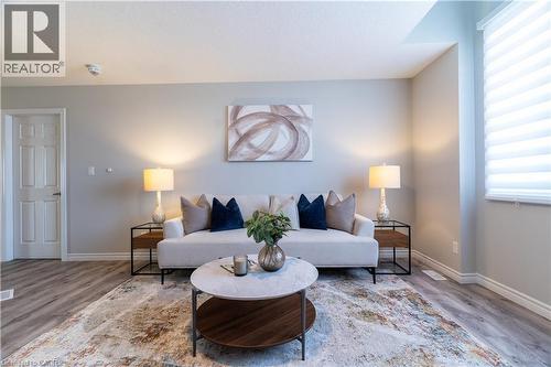 Living room featuring wood finished floors - 709 Rock Elm Street, Waterloo, ON - Indoor Photo Showing Living Room