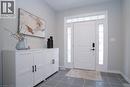 Foyer entrance with dark tile patterned floors and baseboards - 709 Rock Elm Street, Waterloo, ON  - Indoor Photo Showing Other Room 