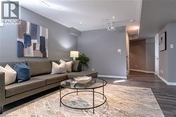 Living room featuring wood finished floors and recessed lighting - 