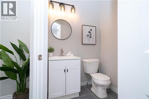 Bathroom with dark tile patterned floors and vanity - 709 Rock Elm Street, Waterloo, ON - Indoor Photo Showing Bathroom