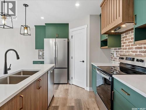 4748 Ferndale Crescent, Regina, SK - Indoor Photo Showing Kitchen With Double Sink With Upgraded Kitchen