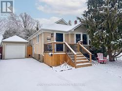 Long paved drive leads to detached single garage - 