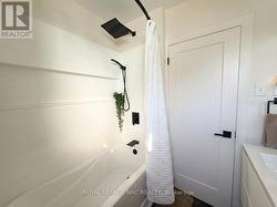 Tile-wall shower w rainfall + handheld showerheads - 