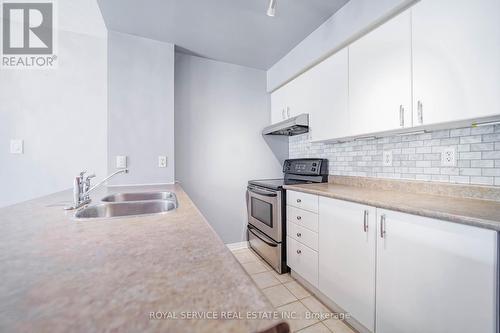 207 - 90 Aspen Springs Drive, Clarington (Bowmanville), ON - Indoor Photo Showing Kitchen With Double Sink