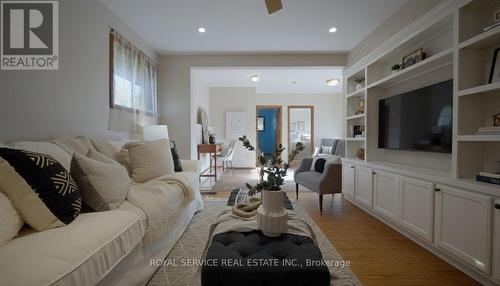 This picture has been virtually staged using AI. - 141 Scugog Street N, Clarington (Bowmanville), ON - Indoor Photo Showing Living Room