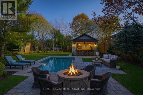 This picture has been virtually staged using AI. - 141 Scugog Street N, Clarington (Bowmanville), ON - Outdoor With In Ground Pool With Deck Patio Veranda With Backyard
