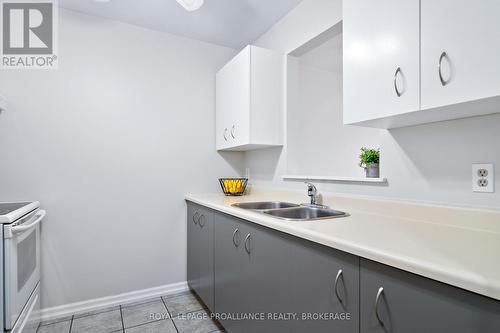 301 - 580 Armstrong Road, Kingston (East Gardiners Rd), ON - Indoor Photo Showing Kitchen With Double Sink