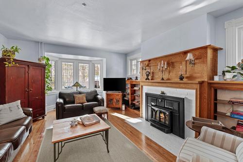 Living room - 322 Rue Woodland, Brownsburg-Chatham, QC - Indoor Photo Showing Living Room With Fireplace