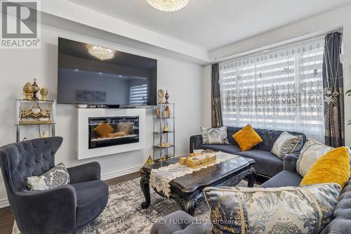 7 Spinland Street, Caledon, ON - Indoor Photo Showing Living Room With Fireplace