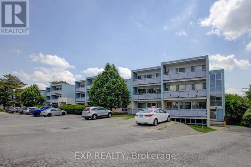 202 - 91 Conroy Crescent, Guelph, ON - Outdoor With Balcony With Facade