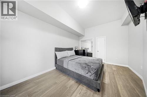 Bedroom featuring light wood-type flooring and a closet - 85 Morrell Street Unit# 102A, Brantford, ON - Indoor Photo Showing Bedroom