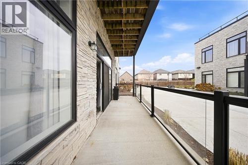 Balcony with a residential view - 85 Morrell Street Unit# 102A, Brantford, ON - Outdoor With Exterior