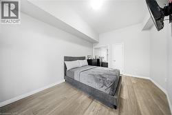 Bedroom featuring light wood-type flooring and a closet - 