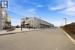View of asphalt road with street lights and curbs - 