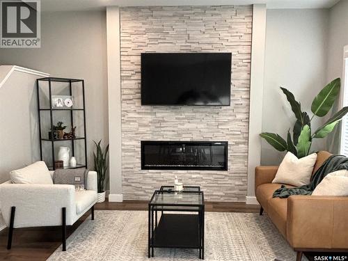 540 Myles Heidt Manor, Saskatoon, SK - Indoor Photo Showing Living Room With Fireplace