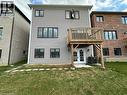 Rear view of house featuring a lawn, a patio, and french doors - 88 Bellhouse Avenue Unit# Bsmt, Brantford, ON  - Outdoor 