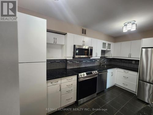 309 - 50 Inverlochy Boulevard, Markham, ON - Indoor Photo Showing Kitchen With Stainless Steel Kitchen