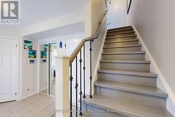 hardwood stairs and iron pickets elegant and clean - 