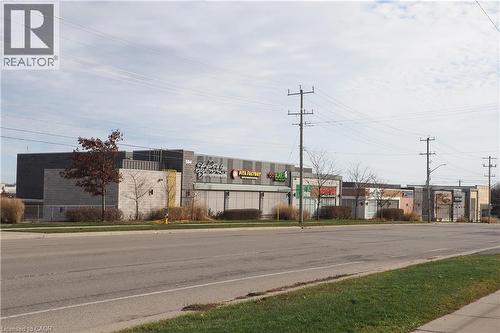 View of asphalt road featuring curbs and sidewalks - 255 Northlake Drive Unit# 27, Waterloo, ON - Outdoor