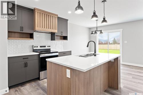 1725 Mustard Street, Regina, SK - Indoor Photo Showing Kitchen With Double Sink