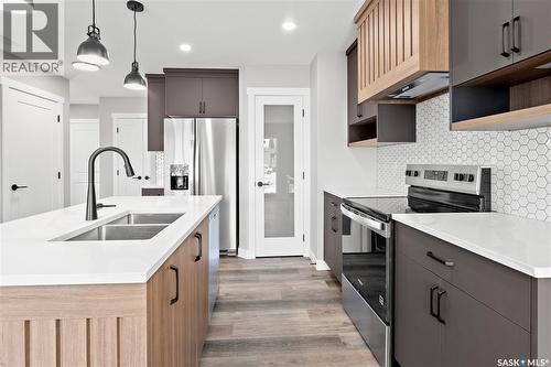 1725 Mustard Street, Regina, SK - Indoor Photo Showing Kitchen With Stainless Steel Kitchen With Double Sink With Upgraded Kitchen