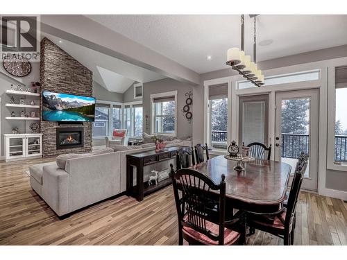 1509 Mount Royal Ridge, Cranbrook, BC - Indoor Photo Showing Dining Room With Fireplace