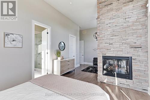 1 Windrose Valley Boulevard, Collingwood, ON - Indoor Photo Showing Bedroom With Fireplace