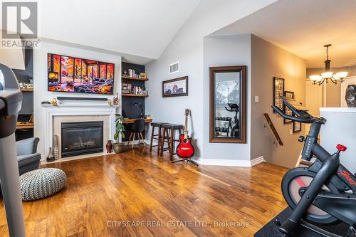 5216 Nova Crescent, Burlington, ON - Indoor Photo Showing Gym Room With Fireplace