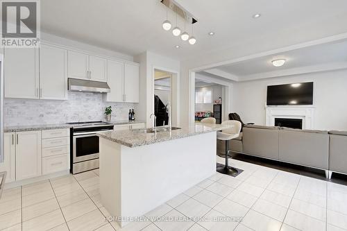 50 Ben Sinclair Avenue, East Gwillimbury, ON - Indoor Photo Showing Kitchen With Fireplace With Double Sink With Upgraded Kitchen