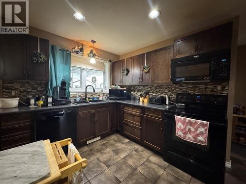 1837 109 Avenue, Dawson Creek, BC - Indoor Photo Showing Kitchen With Double Sink