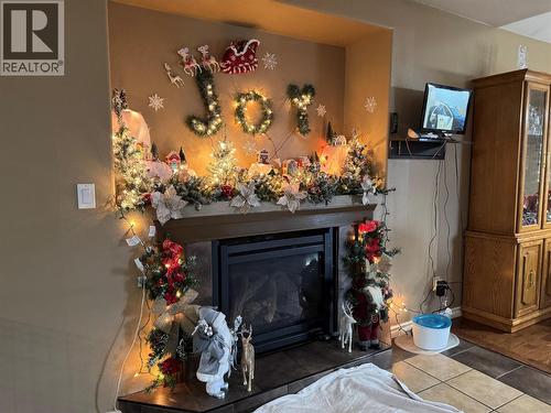 1837 109 Avenue, Dawson Creek, BC - Indoor Photo Showing Living Room With Fireplace
