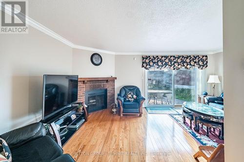 4284 Sawmill Valley Drive, Mississauga, ON - Indoor Photo Showing Living Room With Fireplace