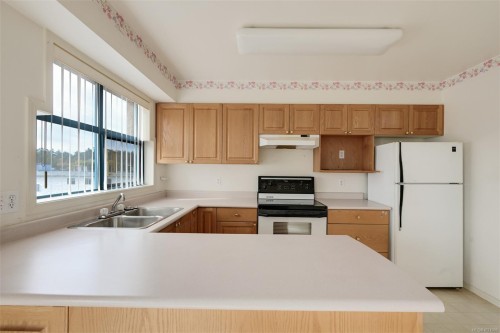 405-1063 Southgate St, Victoria, BC - Indoor Photo Showing Kitchen With Double Sink
