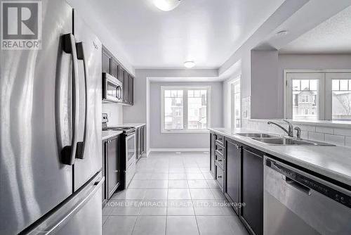 43 Colonel Frank Cheng Crescent, Brampton, ON - Indoor Photo Showing Kitchen With Stainless Steel Kitchen With Double Sink With Upgraded Kitchen